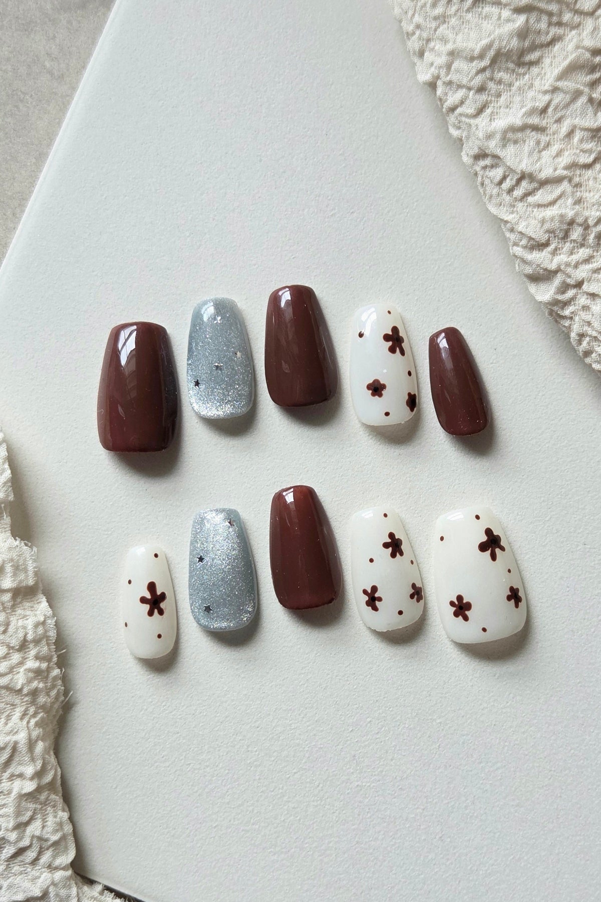 Brown, cream and silver hand-painted press-on nails with floral details – Mocha Bloom by Rosie Posie