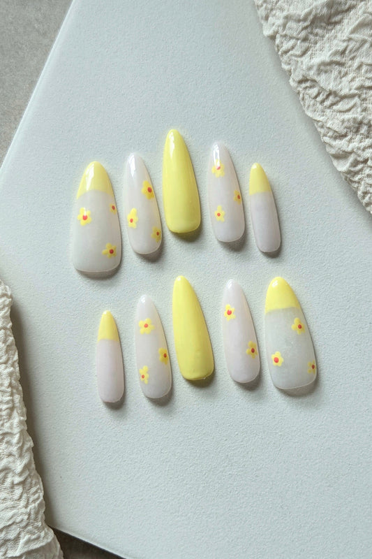 Lemon Daisy yellow and white hand-painted press-on nails with floral and French tip details