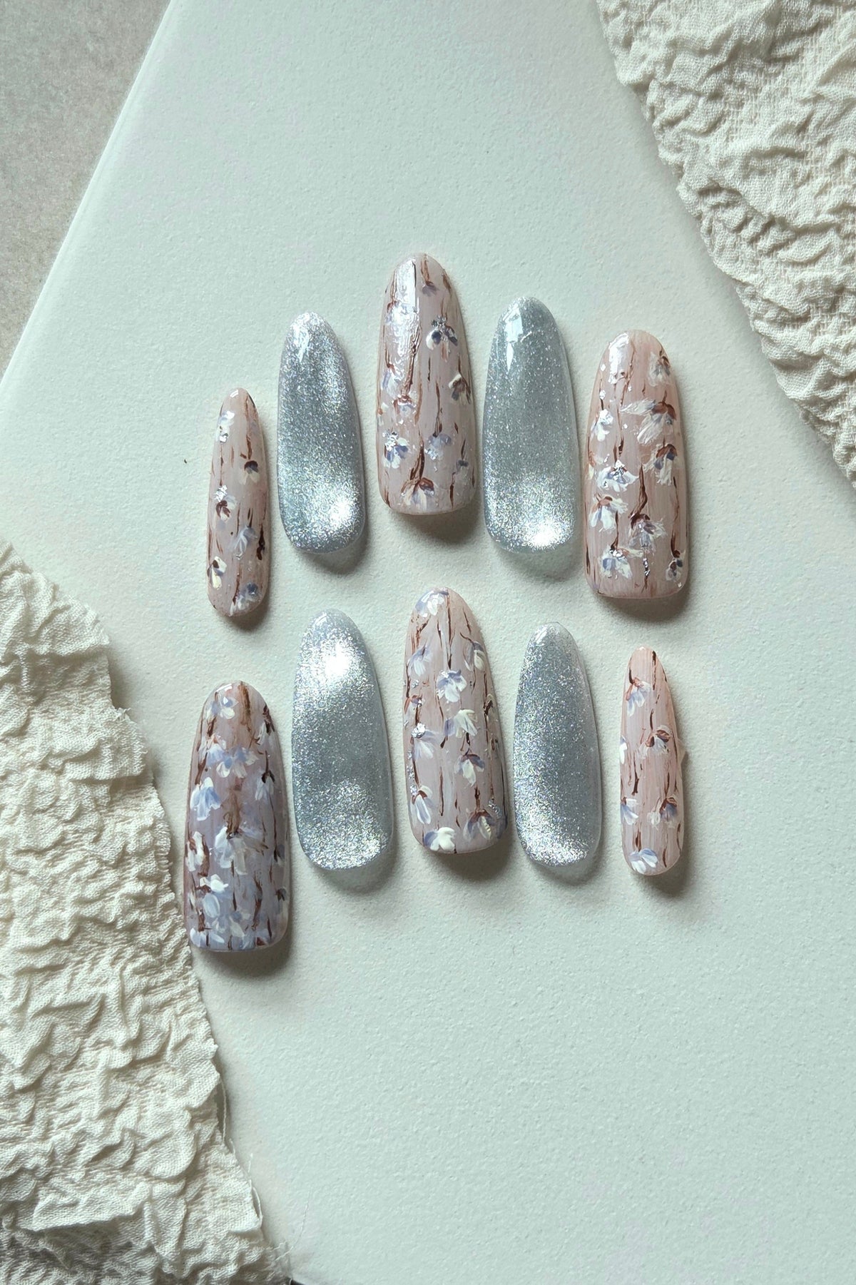 Silver Blossom pink floral and silver cat-eye hand-painted press-on nails